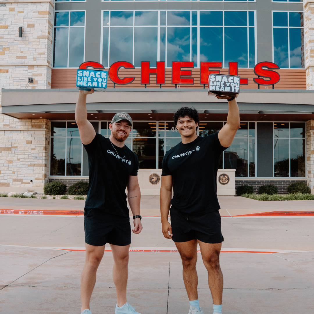 Scott and Angel, Founders of ChunkyFit Protein Cookie in front of Scheels